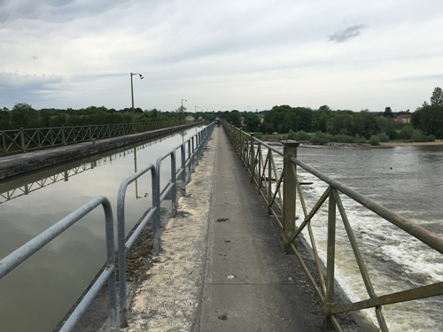 Canal and pedestrian bridge over the Allier River